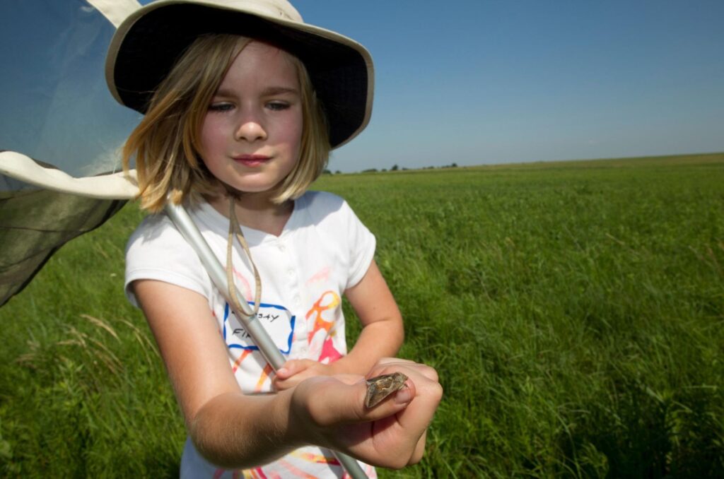 Young girl with moth